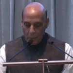 Defence-minister-Rajnath-singh-noticing-Media