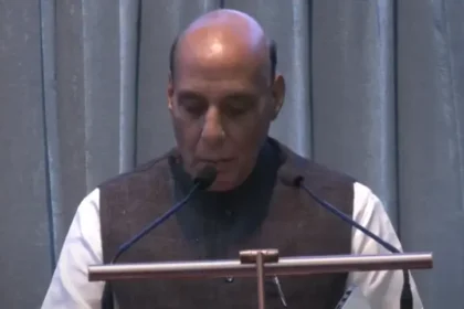 Defence-minister-Rajnath-singh-noticing-Media