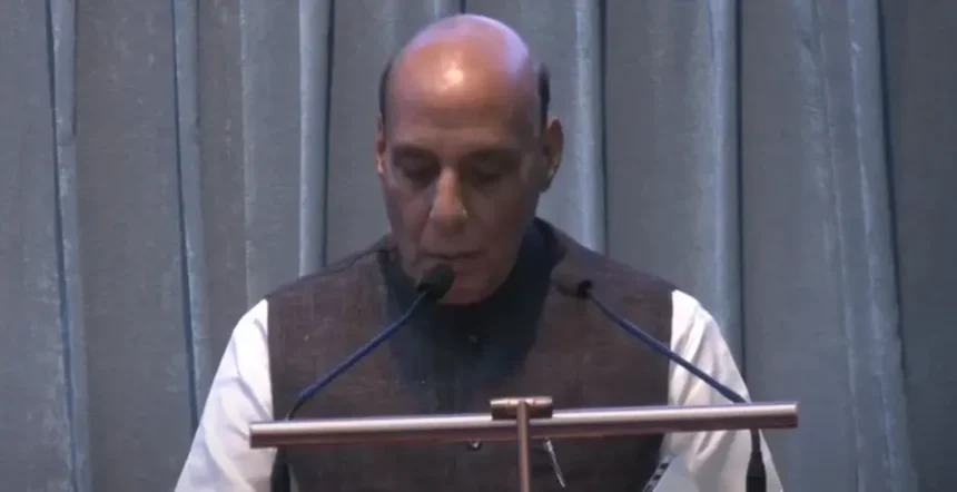Defence-minister-Rajnath-singh-noticing-Media